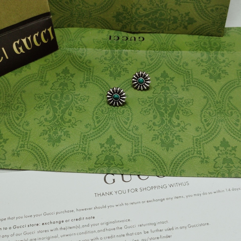 G*u*i earrings
